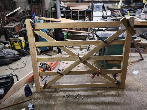 the building of a wooden gate ina workshop