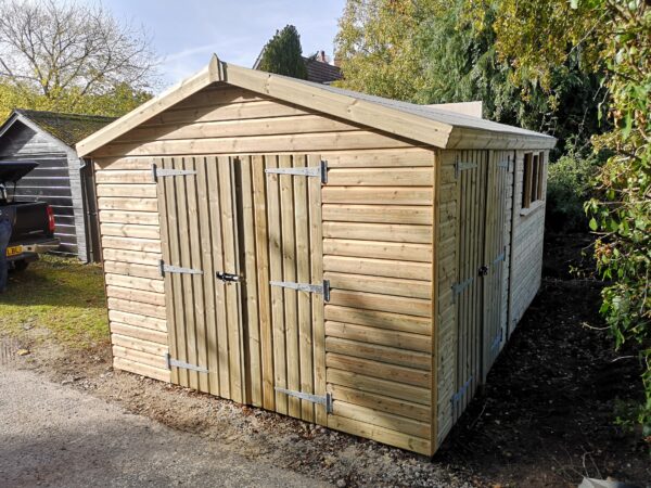 large light wood coloured shed with double doors that are closed