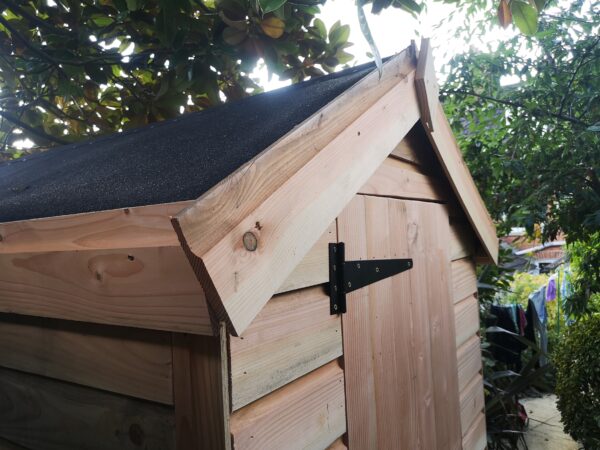 apex with black felt of small wood shed