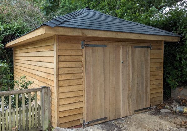 timber garage mage of oak with grey tiled roof